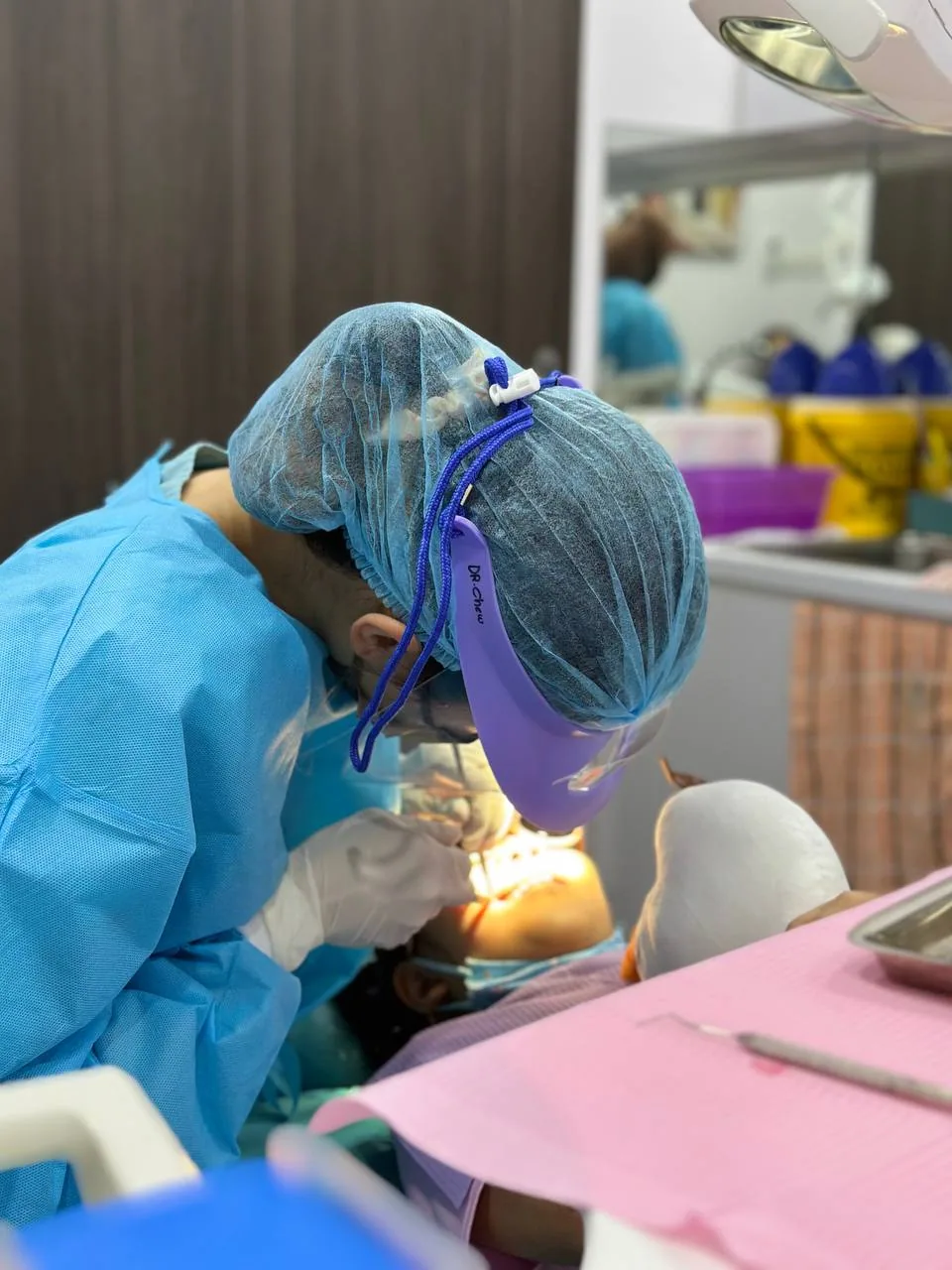 Dentist and assistant carrying out a routine general dentistry treatment to keep teeth healthy and catch problems early