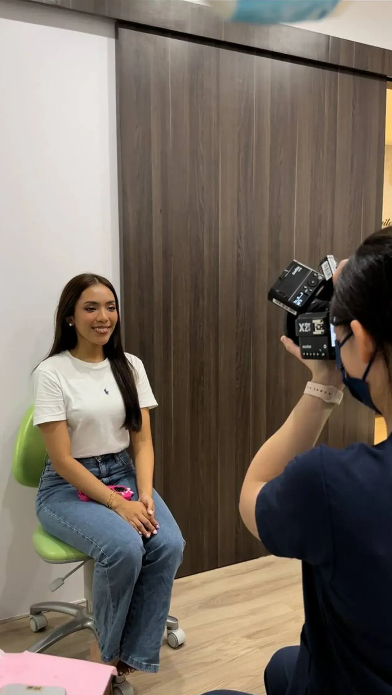Smile makeover photoshoot at our Bukit Jalil clinic, recording the finished veneer result the way the patient will see it every day